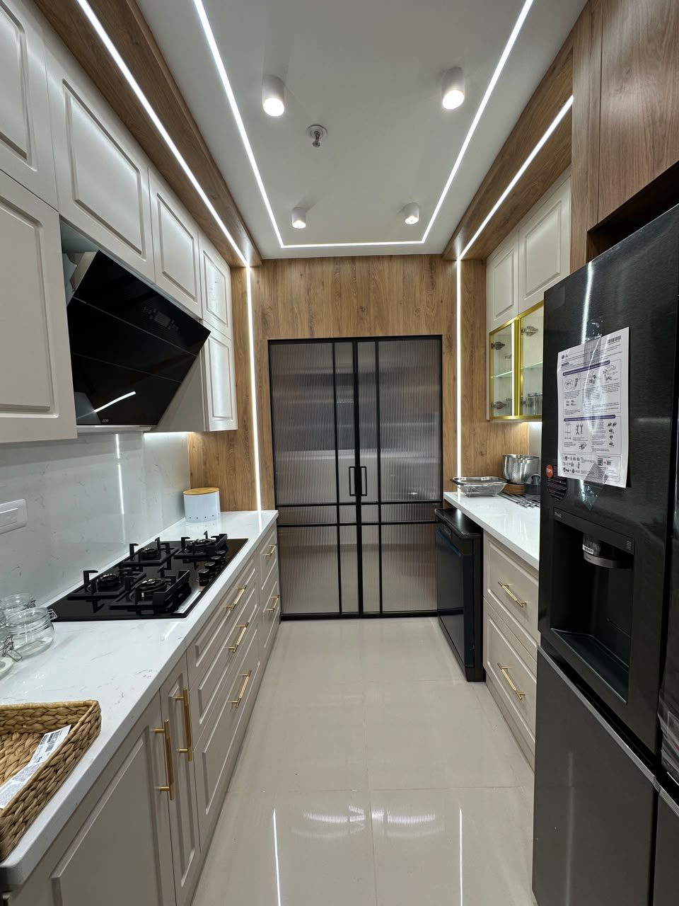 Kitchen utility area with fluted glass shutters